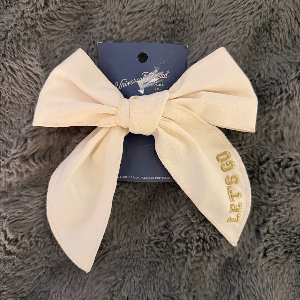 Universal Thread Cream Bow with Gold Text